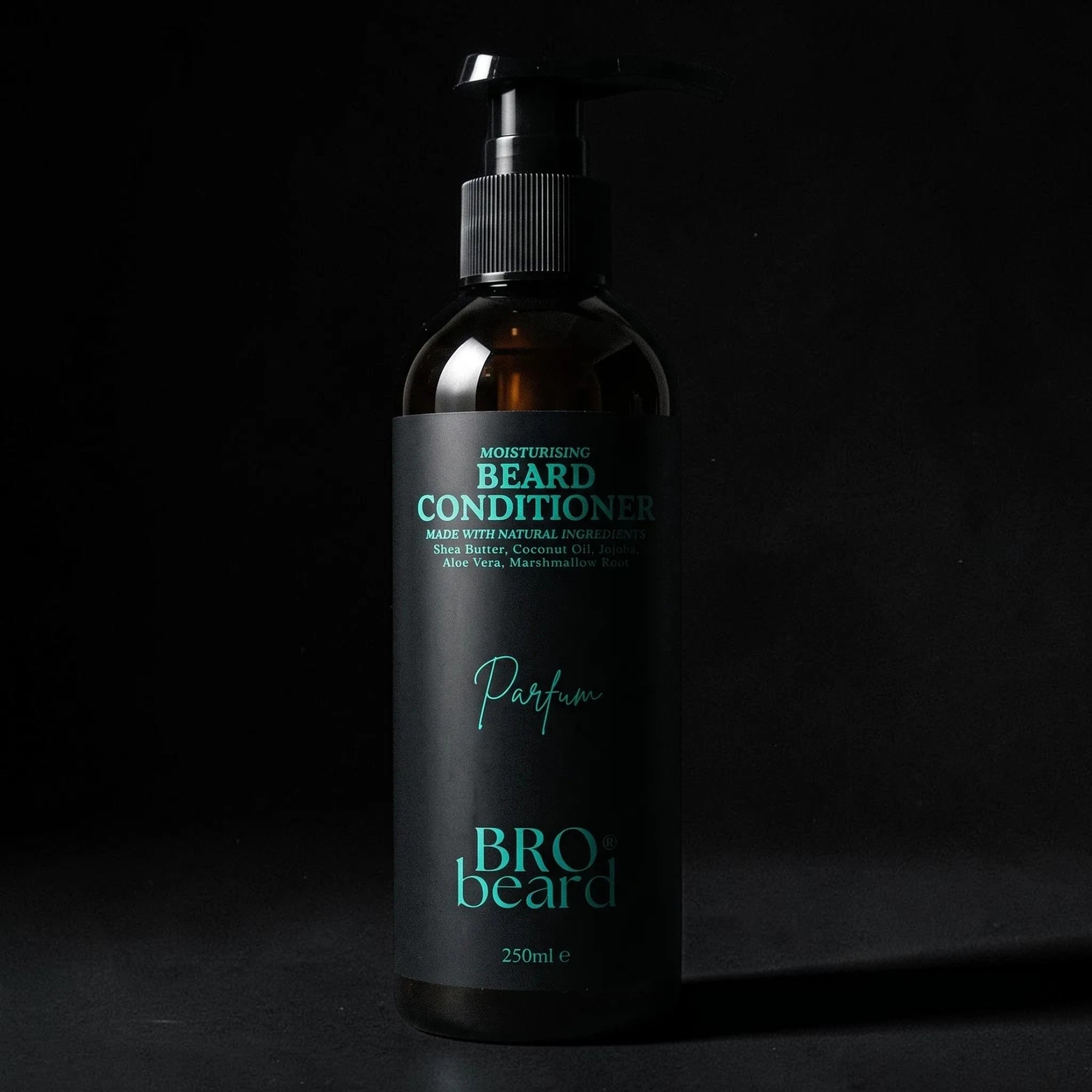 A 250ml pump bottle of BRO beard conditioner with a black label and black dispenser, featuring teal text, set against a dark textured background.