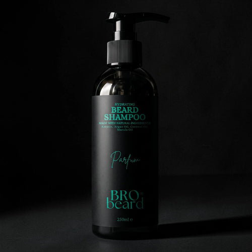 A black pump bottle of Bro Beard Hydrating Beard Shampoo with teal text on a black background.